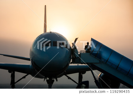 Close up of passenger airplane. Front view in the fog Close up of passenger airplane. Front view in the fog 119290435
