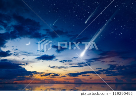 Amazing heavenly image with beautiful glowing sunset, comet and shooting stars, rising crescent moon and bright stars above sea. 119290495