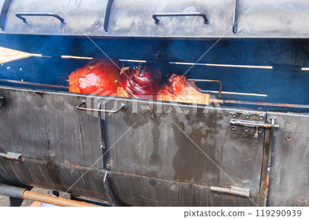Czech smoked ham cooking on charcoal spit roaster in Prague streets, Czech Republic Czech smoked ham cooking on charcoal spit roaster in Prague streets, Czech Republic 119290939