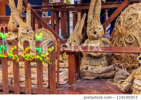 Easter decorative straw rabbit bunnies in Easter market in Prague, Czech Republic 119290953