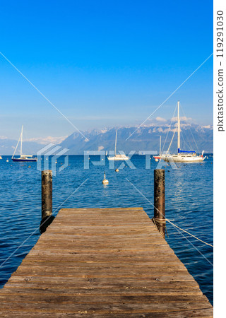 Wooden pier overlooking the Alps and Lake Geneva in Switzerland Wooden pier overlooking the Alps and Lake Geneva in Switzerland 119291030
