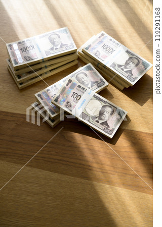 A stack of bills on a table (new bill version) 119291168