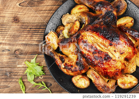 Delicious baked chicken on plate. 119291239