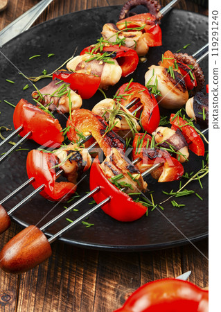 Grilled octopus on skewers. Grilled octopus on skewers. 119291240