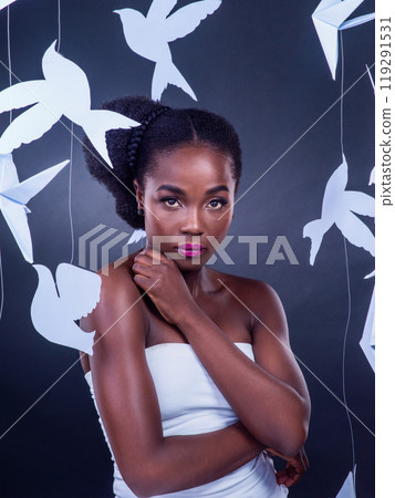 Black woman, origami and creative beauty for fashion, art and confidence or empower in studio with portrait. African girl, fantasy and makeup with paper birds for decor, design and cultural diversity Black woman, origami and creative beauty for fashion, art and confidence or empower in studio with portrait. African girl, fantasy and makeup with paper birds for decor, design and cultural diversity 119291531