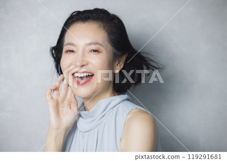 Dressed up middle-aged woman 119291681