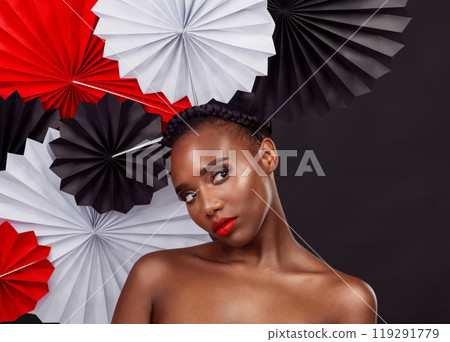 Woman, thinking and beauty with origami fans in studio isolated on a dark background. Face, makeup cosmetics and skincare of black female model with traditional oriental paper art for geisha hat Woman, thinking and beauty with origami fans in studio isolated on a dark background. Face, makeup cosmetics and skincare of black female model with traditional oriental paper art for geisha hat 119291779