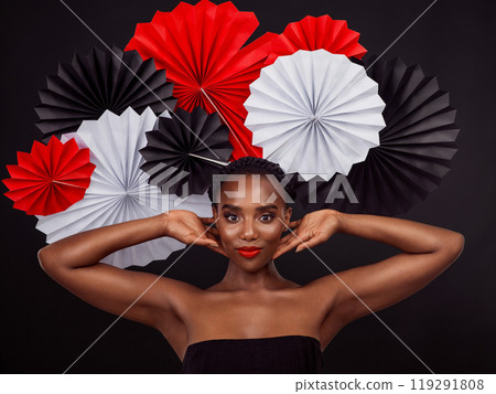 Portrait, African woman and smile with origami on hair in studio background for fashion, art and decor. Female person, artist and glamour for creativity, beauty or design with pride or confidence Portrait, African woman and smile with origami on hair in studio background for fashion, art and decor. Female person, artist and glamour for creativity, beauty or design with pride or confidence 119291808