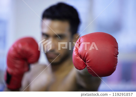 Fitness, boxing and glove of man closeup for exercise, workout or training for healthy body wellness in gym. Sport, fist and serious athlete in club for fight practice, competition and martial arts 119291857