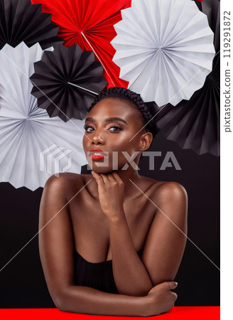 Creative, portrait and black woman with origami fans in studio, beauty and dark background. Face, makeup and cosmetics of female model with pride, traditional care and paper art for culture hat Creative, portrait and black woman with origami fans in studio, beauty and dark background. Face, makeup and cosmetics of female model with pride, traditional care and paper art for culture hat 119291872