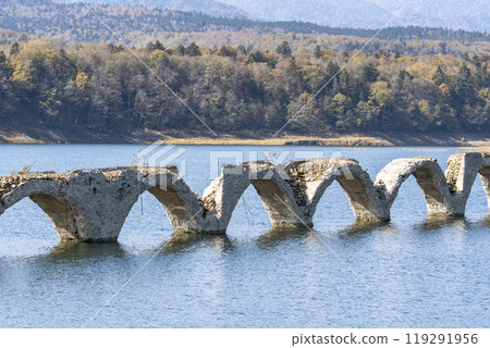 Taushubetsu River Bridge on the former Shihoro Line of the Japanese National Railways on a clear autumn day in Kamishihoro, Hokkaido 119291956