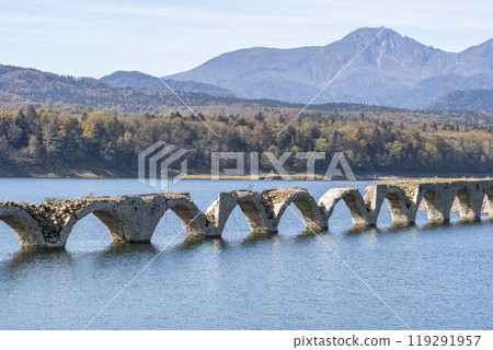 Taushubetsu River Bridge on the former Shihoro Line of the Japanese National Railways on a clear autumn day in Kamishihoro, Hokkaido 119291957