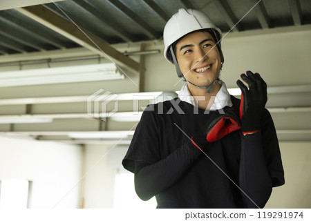 Workers dismantling steel beams 119291974