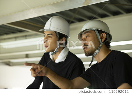 Workers dismantling steel beams Workers dismantling steel beams 119292011