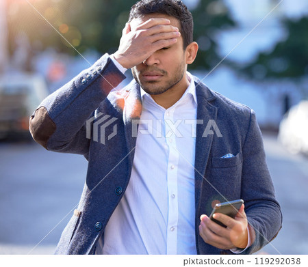 Businessman, stress and walking with phone, message and outdoor or upset with face palm. Hispanic person ,frustrated and bad news for investments, problem and mobile while worried, work and urban 119292038