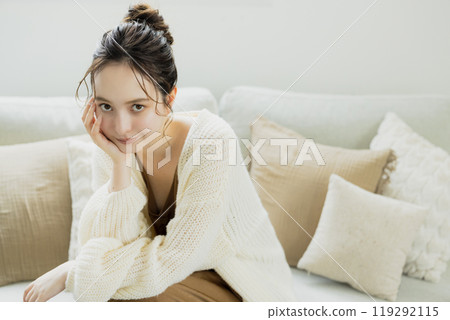 A woman relaxing in a knitted room 119292115