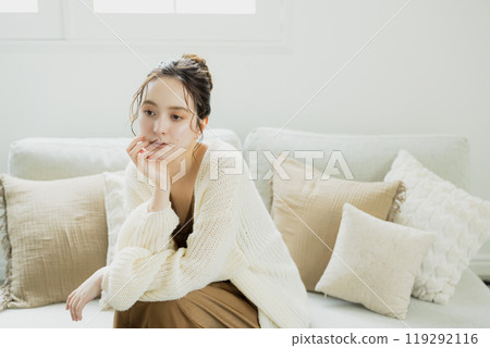 A woman relaxing in a knitted room 119292116