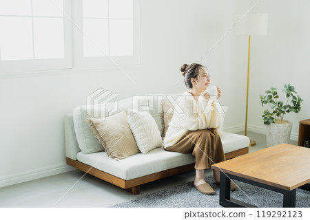 A woman relaxing in a knitted room 119292123