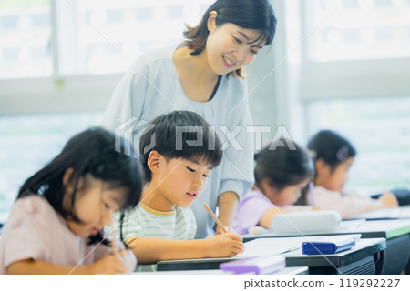 Elementary school students taking lessons in a classroom 119292227