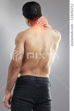 Studio, man and neck pain after fitness, muscle tension and injury from training as medical crisis. Back, male model and joint ache with inflammation, sports accident or bursitis by gray background Studio, man and neck pain after fitness, muscle tension and injury from training as medical crisis. Back, male model and joint ache with inflammation, sports accident or bursitis by gray background 119292252