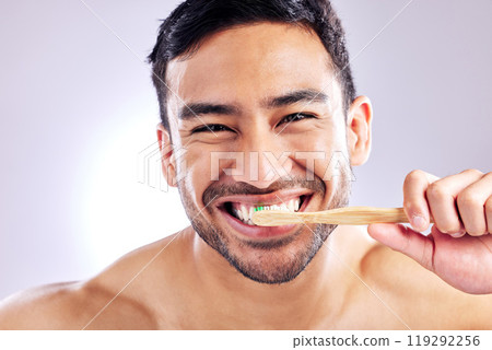 Grooming, portrait and man with toothbrush for teeth, wash and routine of hygiene in morning and dental. Oral health, wellness and person with smile in white background, studio and cleaning of tooth Grooming, portrait and man with toothbrush for teeth, wash and routine of hygiene in morning and dental. Oral health, wellness and person with smile in white background, studio and cleaning of tooth 119292256