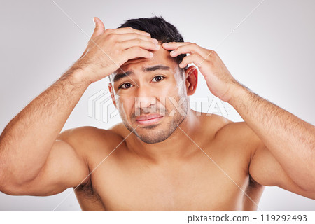 Acne, beauty and portrait of natural man in studio on white background for inspection or skincare. Blemish, face and pimple of male model in bathroom for cleaning, examination or aesthetic wellness 119292493