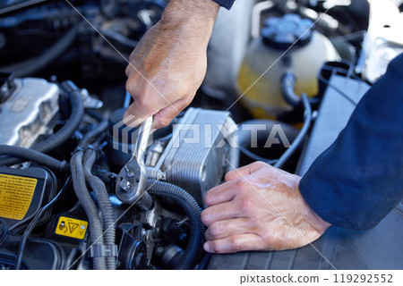 Man, closeup and engine with tools for service in garage, inspection or maintenance on car. Male mechanic, auto and check for problem with oil or motor, technician working with wrench for transport 119292552