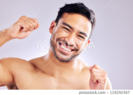 Oral health, portrait and man with flossing of teeth, wash and routine of hygiene in morning and dental. Studio, wellness and person with smile in white background, grooming and cleaning of tooth 119292567