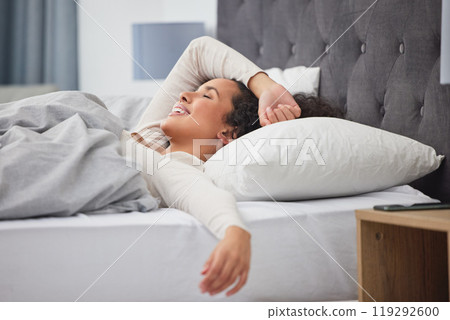 Weekend, wake up and happy woman in bed with wellness, relax and morning dream in apartment. Face, smile and girl in bedroom with peace, calm and sleep for health, comfort and natural rest in home. Weekend, wake up and happy woman in bed with wellness, relax and morning dream in apartment. Face, smile and girl in bedroom with peace, calm and sleep for health, comfort and natural rest in home. 119292600