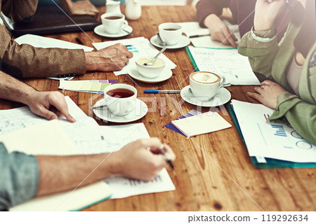 Business people, hands and paperwork with graphs at meeting report for company, productivity or strategy. Documents, coffee and table for brainstorming growth with data notes, planning or statistics 119292634