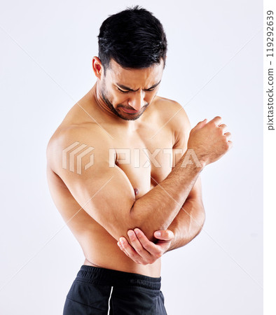 Muscular man, elbow and bone with injury or pain from accident or fall on a white studio background. Frustrated male person or bodybuilder with sore arm, muscle or joint from tension or inflammation Muscular man, elbow and bone with injury or pain from accident or fall on a white studio background. Frustrated male person or bodybuilder with sore arm, muscle or joint from tension or inflammation 119292639