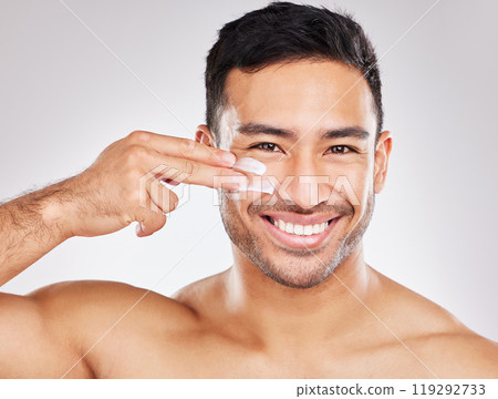 Face, portrait and asian man with lotion in studio for skin hydration, anti aging or collagen. Moisturizer, male model or skincare with cosmetics for smooth, glow or soft texture by white background Face, portrait and asian man with lotion in studio for skin hydration, anti aging or collagen. Moisturizer, male model or skincare with cosmetics for smooth, glow or soft texture by white background 119292733