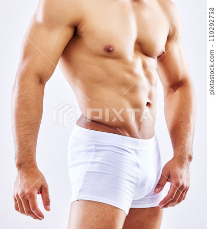 Chest, muscle and man in underwear on studio, white background or mockup of bodybuilder abdomen. Healthy, athlete and stomach of model with abs from fitness with exercise and workout at gym aesthetic 119292758
