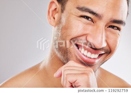 Portrait, skincare and man with cosmetics, smile and dermatology on white studio background. Face detox, person and model with confidence, beauty and grooming routine with shine, glowing and wellness Portrait, skincare and man with cosmetics, smile and dermatology on white studio background. Face detox, person and model with confidence, beauty and grooming routine with shine, glowing and wellness 119292759