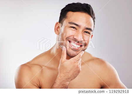 Portrait, skincare and man with cosmetics, wellness and dermatology on white studio background. Face, person and model with beauty, healthy skin and grooming routine with shine, luxury and aesthetic Portrait, skincare and man with cosmetics, wellness and dermatology on white studio background. Face, person and model with beauty, healthy skin and grooming routine with shine, luxury and aesthetic 119292918
