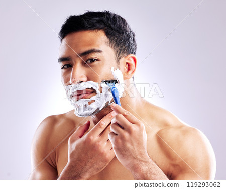 Portrait, man and shaving with razor for skincare, health or hair removal for hygiene isolated on white studio background. Cream, face or model cut beard for cleaning, grooming or beauty for wellness 119293062