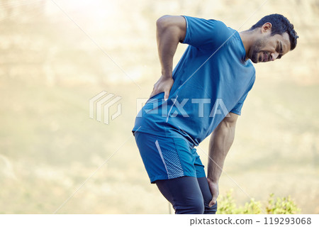 Health, fitness and man with back injury from running training or practice outdoor in nature. Asian male person and athlete with muscle pain and aching body from workout for medical emergency Health, fitness and man with back injury from running training or practice outdoor in nature. Asian male person and athlete with muscle pain and aching body from workout for medical emergency 119293068