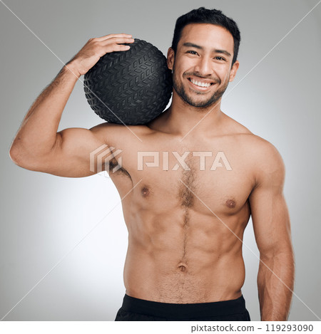 Fitness, medicine ball and portrait of shirtless man in studio on gray background for health or hydration. Body, exercise and smile with happy or strong sports person at gym for training or workout Fitness, medicine ball and portrait of shirtless man in studio on gray background for health or hydration. Body, exercise and smile with happy or strong sports person at gym for training or workout 119293090