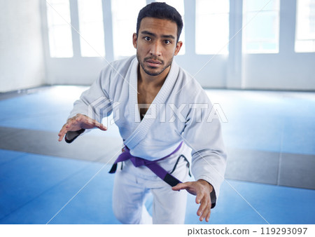 Man, portrait or fighting for martial arts sport in fitness center for self defense, ready or discipline. Athlete, pov and serious with uniform for training, practice or wellness for competition Man, portrait or fighting for martial arts sport in fitness center for self defense, ready or discipline. Athlete, pov and serious with uniform for training, practice or wellness for competition 119293097