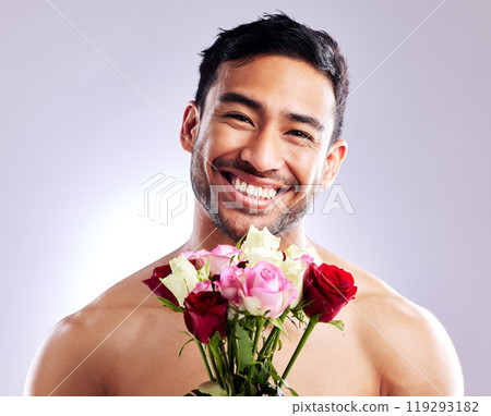 Man, portrait and shirtless with rose in studio for natural scent, luxury fragrance and cosmetics. Spanish model, flowers and naked on background with mockup space for organic or designer cologne 119293182