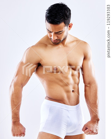 Strong, muscle and man in underwear on studio, white background or mockup of bodybuilder abdomen. Healthy, athlete and flexing model with abs from fitness with exercise or workout at gym aesthetic 119293383