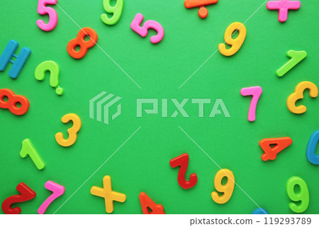 Many colorful numbers on green background with copy space. Many colorful numbers on green background with copy space. 119293789