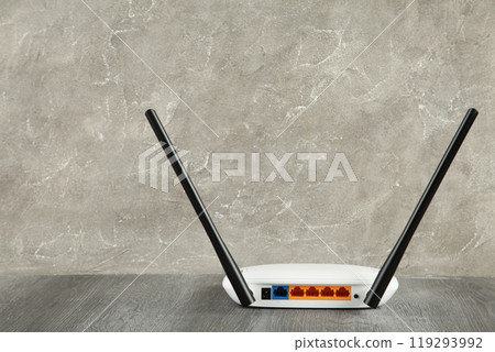 Wireless Wi-Fi router on grey background with copy space 119293992