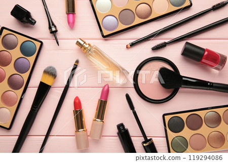 Different luxury makeup products on pink background, flat lay Different luxury makeup products on pink background, flat lay 119294086