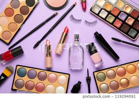 Different luxury makeup products on purple background, flat lay 119294091