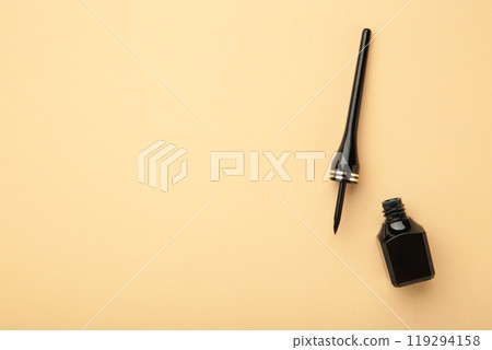 Eyeliner on beige background with copy space. Top view Eyeliner on beige background with copy space. Top view 119294158