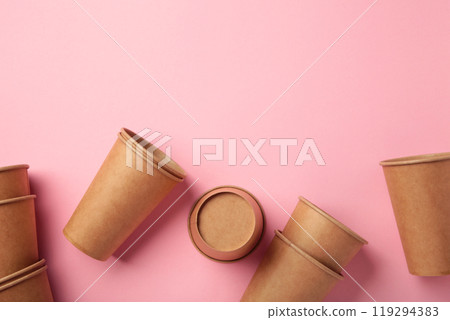 Disposable paper cups on pink background. Coffee concept. 119294383