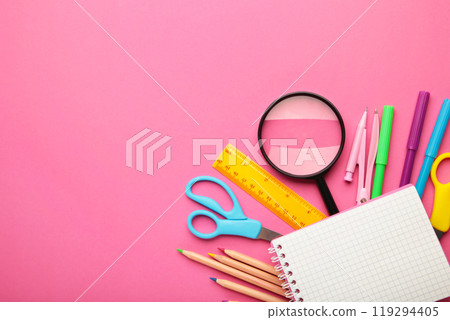 School supplies with notebook on pink background. Back to school. Flat lay. School supplies with notebook on pink background. Back to school. Flat lay. 119294405