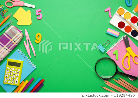 School supplies on green background with copy space. Back to school concept. School supplies on green background with copy space. Back to school concept. 119294450