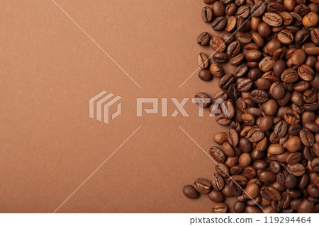 Coffee beans on brown background. Top view. Coffee beans on brown background. Top view. 119294464